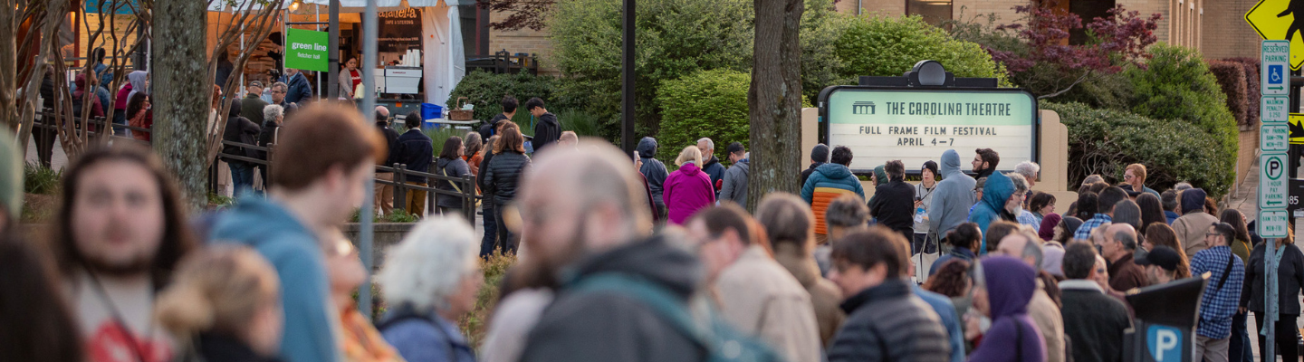 Crowd queuing in front of Fletcher Hall